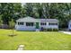 Charming single-story home with a freshly mowed lawn, and vibrant green door at 3615 Kempton Pl, Charlotte, NC 28208
