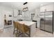 Bright white kitchen featuring stainless steel appliances, a center island, and shaker cabinets at 3615 Kempton Pl, Charlotte, NC 28208