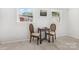 Bright room with natural light, wood-look flooring, chess table and chairs at 3615 Kempton Pl, Charlotte, NC 28208
