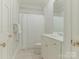 Clean bathroom featuring white vanity, subway tile shower, and neutral color palette at 4026 Barclay Downs Dr, Charlotte, NC 28209