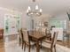 Open floor plan with dining area flowing into the living room at 4026 Barclay Downs Dr, Charlotte, NC 28209