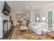 Spacious living room showcases a fireplace, open floor plan, and hardwood floors at 4026 Barclay Downs Dr, Charlotte, NC 28209