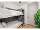 Comfortable bedroom featuring bunk beds, natural light, and a serene ambiance at 411 Granby Cir, Charlotte, NC 28217