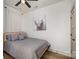 Cozy bedroom featuring a comfortable bed with decorative pillows and a unique animal print wall art at 411 Granby Cir, Charlotte, NC 28217