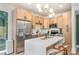 Modern kitchen featuring stainless steel appliances, a large island, and stylish light fixtures at 411 Granby Cir, Charlotte, NC 28217