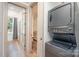 Hallway with a stacked washer and dryer unit, and doorways leading to other parts of the home at 411 Granby Cir, Charlotte, NC 28217