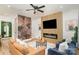 Inviting living room featuring a decorative wall, sleek fireplace, and comfortable seating arrangements at 411 Granby Cir, Charlotte, NC 28217