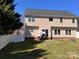 Spacious backyard featuring a patio area with outdoor seating, perfect for entertaining at 435 Riverwalk Nw Dv, Concord, NC 28027