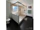 Modern bathroom featuring an open shower, dark floors, and neutral tile at 435 Riverwalk Nw Dv, Concord, NC 28027