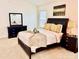 Well-appointed bedroom with carpet, neutral colors, and a comfortable bed and linens at 435 Riverwalk Nw Dv, Concord, NC 28027