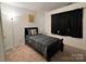 Cozy bedroom features a twin bed, dark wood trim, and natural light at 435 Riverwalk Nw Dv, Concord, NC 28027