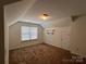 Large room with carpet, a door, and a window with white blinds at 435 Riverwalk Nw Dv, Concord, NC 28027