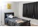 Cozy bedroom features a twin bed, dark wood trim, and natural light at 435 Riverwalk Nw Dv, Concord, NC 28027