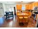 Open concept kitchen featuring an island with bar stools, cabinets, and stainless steel appliances at 435 Riverwalk Nw Dv, Concord, NC 28027