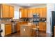 Spacious kitchen featuring cabinets, an island, stainless appliances, and tile backsplash at 435 Riverwalk Nw Dv, Concord, NC 28027