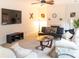 Inviting living room featuring a ceiling fan and fireplace at 435 Riverwalk Nw Dv, Concord, NC 28027