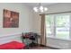 The office has a work desk, trim molding and natural light at 435 Riverwalk Nw Dv, Concord, NC 28027