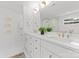 Elegant bathroom featuring a double sink vanity with brass fixtures and marble countertops at 4562 Rockford Ct, Charlotte, NC 28209