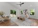 Bright bedroom with natural light, hardwood floors, vaulted ceiling, and a view of the private backyard at 4562 Rockford Ct, Charlotte, NC 28209