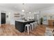 Bright kitchen featuring a large island, stainless steel appliances, and hardwood floors at 4562 Rockford Ct, Charlotte, NC 28209