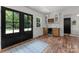 Kitchen area with hardwood floors, built in wine storage and exterior access at 4562 Rockford Ct, Charlotte, NC 28209