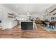 Open floorplan featuring a spacious living room, dining area and kitchen, all beautifully illuminated at 4562 Rockford Ct, Charlotte, NC 28209