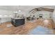 Open floorplan featuring a spacious living room, dining area and kitchen, all beautifully illuminated at 4562 Rockford Ct, Charlotte, NC 28209