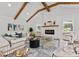 Cozy living room featuring a fireplace, exposed beams, shiplap accent wall, and stylish furnishings at 4562 Rockford Ct, Charlotte, NC 28209