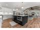 Open floorplan featuring a spacious living room, dining area and kitchen, all beautifully illuminated at 4562 Rockford Ct, Charlotte, NC 28209