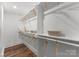Spacious walk-in closet with custom shelving and storage solutions, perfect for organization and convenience at 4562 Rockford Ct, Charlotte, NC 28209