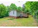 Expansive backyard, featuring a wooden deck and mature trees at 51 Emily Ln, Taylorsville, NC 28681