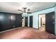 Bedroom with black closet doors and neutral carpet at 51 Emily Ln, Taylorsville, NC 28681