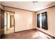 Bedroom featuring tan walls, brown carpet, and dark trim at 51 Emily Ln, Taylorsville, NC 28681
