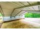 Attached carport with concrete pad offers covered parking and protection from the elements at 51 Emily Ln, Taylorsville, NC 28681