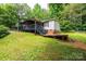 Exterior of the home featuring a covered front porch and wooden steps at 51 Emily Ln, Taylorsville, NC 28681