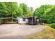 Charming exterior of home with a carport, covered porch, and well-maintained lawn at 51 Emily Ln, Taylorsville, NC 28681
