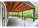 Spacious covered porch with wood ceiling and floor providing ample outdoor living at 51 Emily Ln, Taylorsville, NC 28681