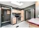 Kitchen with stainless steel oven, light wood cabinetry, and access to other rooms at 51 Emily Ln, Taylorsville, NC 28681