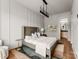 A serene bedroom with modern lighting, neutral tones, and stylish decor that creates a relaxing atmosphere at 5432 Carmel Rd, Charlotte, NC 28210