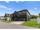 Beautiful house with a modern design, featuring clean lines and a well-kept lawn at 5432 Carmel Rd, Charlotte, NC 28210
