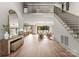 Grand foyer with a view to the open-concept living space and staircase at 5432 Carmel Rd, Charlotte, NC 28210