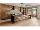 Modern kitchen features an island with seating and sleek cabinetry at 5432 Carmel Rd, Charlotte, NC 28210