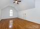 Spacious bonus room with hardwood floors and arched window providing natural light at 5816 Valley Stream Trl, Waxhaw, NC 28173
