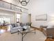 Spacious living room features hardwood floors, natural light, and comfortable seating arrangements at 5816 Valley Stream Trl, Waxhaw, NC 28173