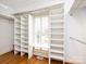 Spacious walk-in closet with custom shelving and a built-in desk area at 5816 Valley Stream Trl, Waxhaw, NC 28173