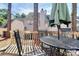 Inviting outdoor back deck area with a table and chairs, perfect for relaxing and enjoying the outdoors at 5953 Prescott Ct # 3105, Charlotte, NC 28269
