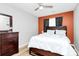 Cozy bedroom with a wooden bed frame, a wood dresser and bright, neutral paint at 5953 Prescott Ct # 3105, Charlotte, NC 28269