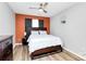 Comfortable bedroom with neutral paint, and a wooden bed frame and dresser at 5953 Prescott Ct # 3105, Charlotte, NC 28269