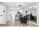 The dining area features modern lighting and has open access to kitchen and hallway at 5953 Prescott Ct # 3105, Charlotte, NC 28269