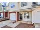 Cozy townhome with a single-car garage, a brick facade, and a private entrance at 5953 Prescott Ct # 3105, Charlotte, NC 28269